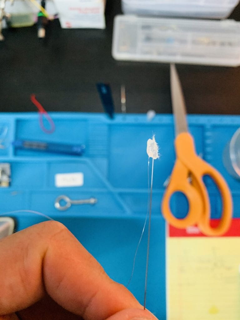 steel wire secured to nichrome using a small bead of hot glue